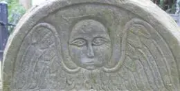 Angelic face on old tombstone