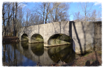 Stone bridge over calm river