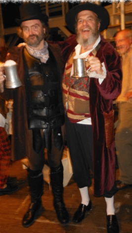 Friends in Victorian-style clothing with drinks