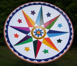 Vibrant star pattern on round barn quilt